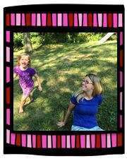 Young girl and mother with clover necklaces and jewelry playing outside together.