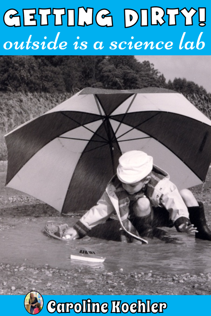 Kids playing in dirt, mud puddle and the rain with a toy boat and a large striped umbrella.