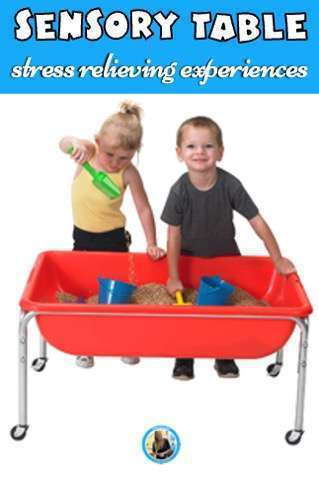 Two children digging in a sensory table.