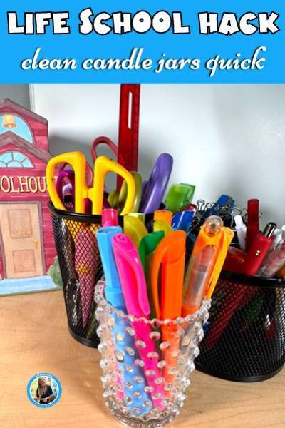Life school hack to clean candle jars quick. Shows picture of a clean candle jar holding highlighters on a teacher's desk.