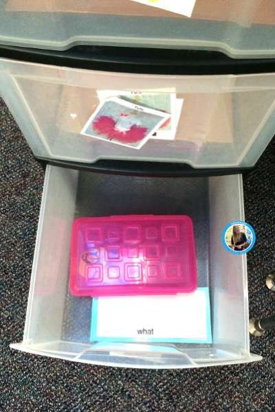 Picture of a student with a learning disability's 3 drawer work station showing a sight word activity for the word, "what."