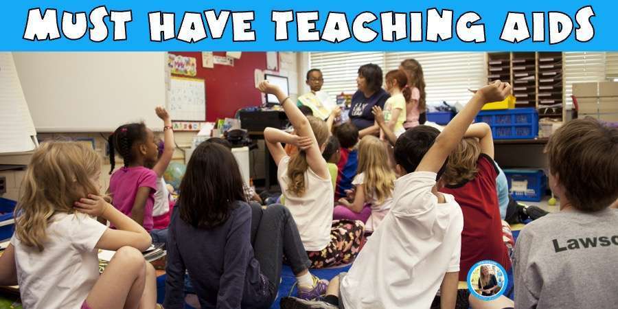 Must have teaching aids showing a picture of a teacher in a classroom.