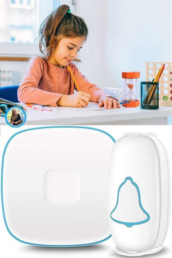 Picture of a student using a sand timer teaching aid and a wireless doorbell teaching aide.