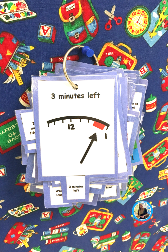 Picture of visual cue cards with a three minutes left sign up to help a four year old tantrum.
