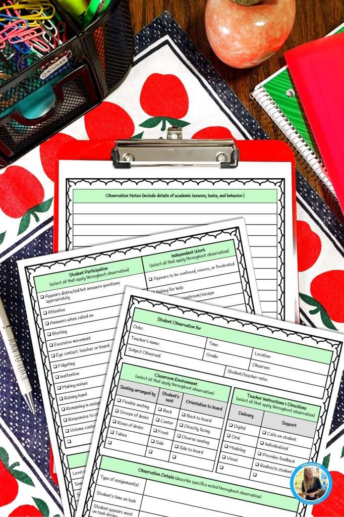 Student observation forms for teachers shown on a teacher's desk at school.